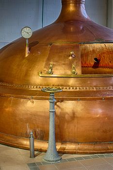 Traditional copper distillery tanks in a beer brewery