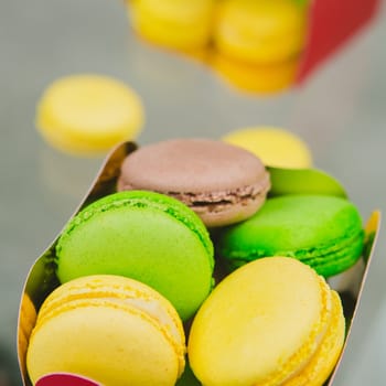 A lot of french colorful macarons. shallow dof