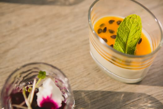 Catering. Salad in a glass on a wooden table