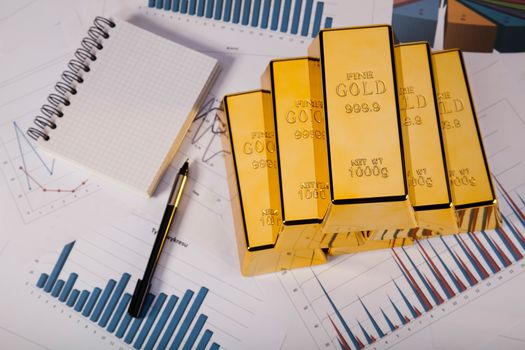 Gold bars and coins, ambient financial concept