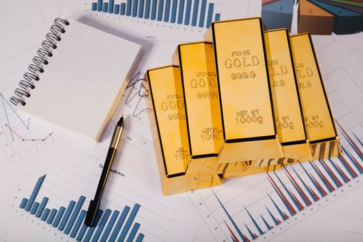 Gold bars and coins, ambient financial concept