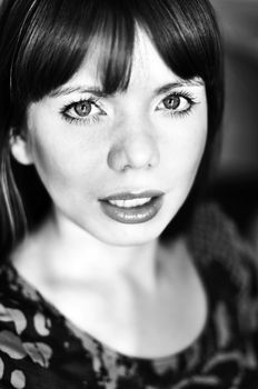 bright portrait of young woman in soft selective focus and  in black and white
