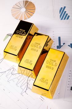 Gold bars with a linear graph, ambient financial concept