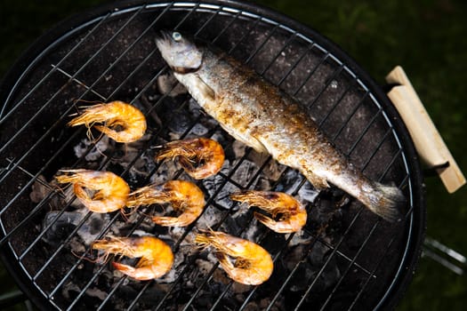 Grilling fish and shrimps, bright colorful vivid theme