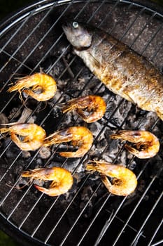 Grilling fish and shrimps, bright colorful vivid theme