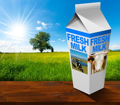 White packaging of fresh milk with text Fresh milk, in a countryside landscape with green grass and a tree on blue sky with clouds and sun rays