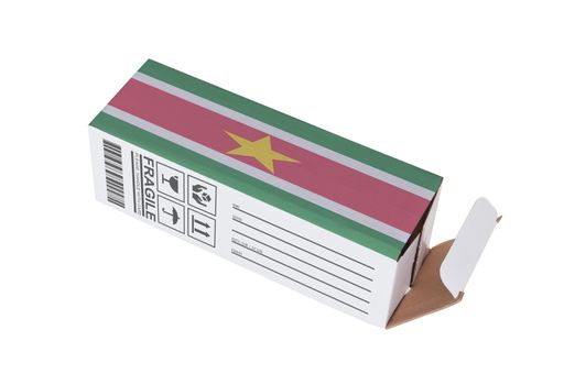 Concept of export, opened paper box - Product of Suriname