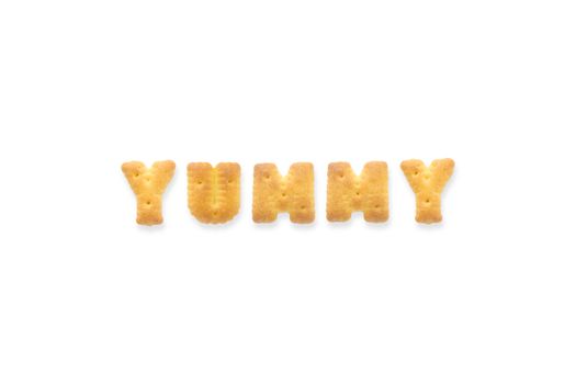 Collage of the character word YUMMY. Alphabet cookie cracker isolated on white background