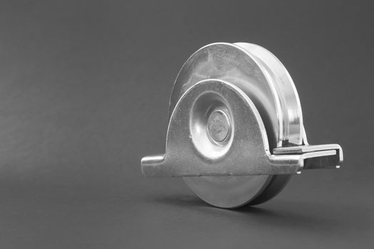 Close up of a pair of bearings used in sliding doors industrial