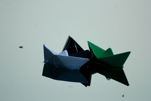 Paper boat floating on water