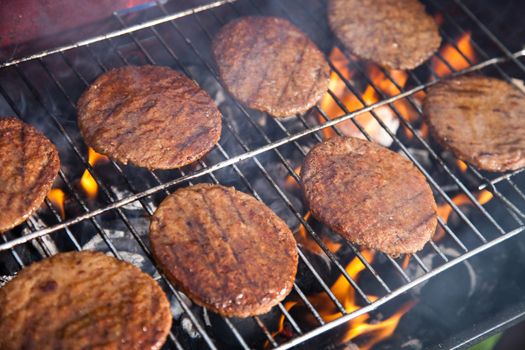 Grilling meat in flames, tasty dinner
