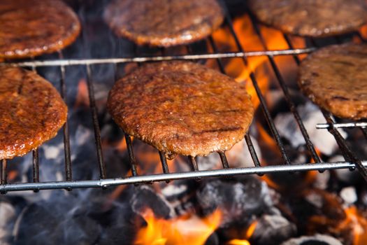 Grilling meat in flames, tasty dinner
