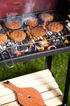 Grilling meat in flames, tasty dinner