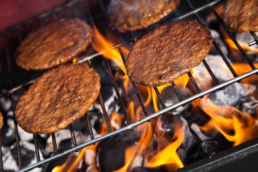 Grilling meat in flames, tasty dinner
