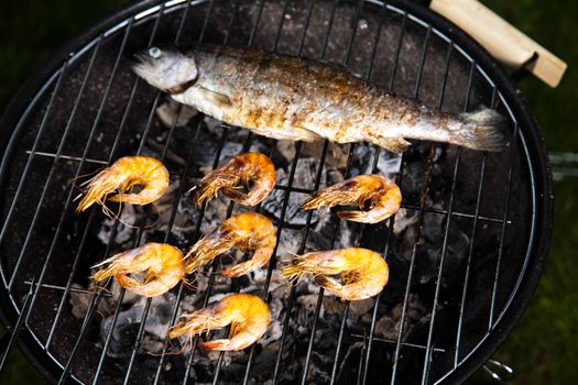Grilling fish and shrimps, bright colorful vivid theme
