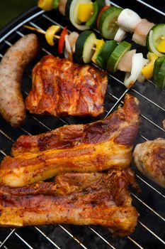 Grilling meat in flames, tasty dinner