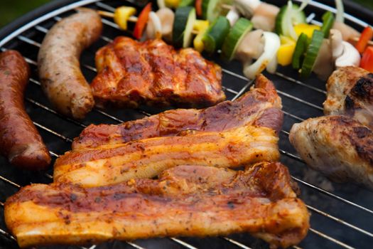 Grilling meat in flames, tasty dinner