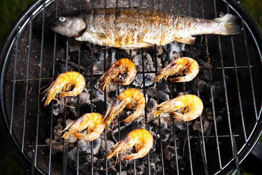 Grilling fish and shrimps, bright colorful vivid theme