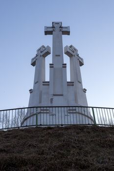 VILNIUS, LITHUANIA -March 19, 2015: Monument of Three Crosses on the Bleak Hill at the dawn time. It is one of main landmarks of Lithuania Capital city.