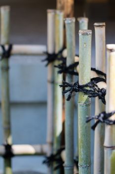 A fence in Japan made from pieces of bamboo.