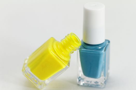 Colorful nail polish - white background, yellow and blue style