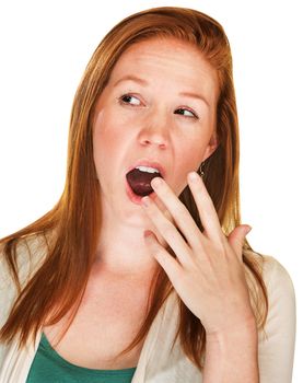 Isolated bored young adult woman covering mouth while yawning