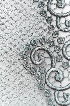 Decorative silver lace on insolated white background