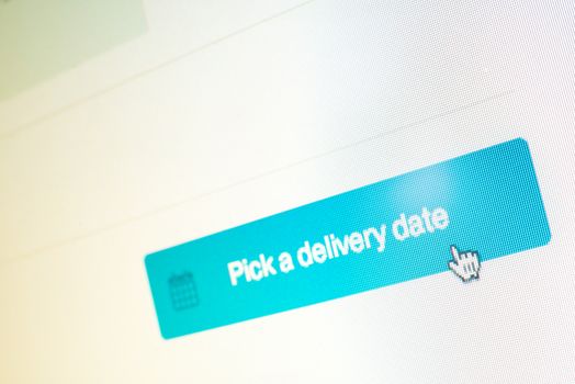 Mouse clicking "pick a delivery date" button on website while online shopping