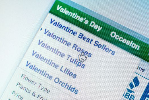 Mouse clicking "Valentines roses" link on website while online shopping