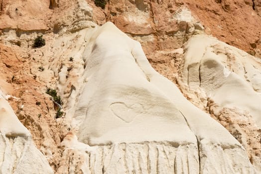 heart shape of love in the Cliffs at Praia da Falesia near villamoura in portugal area algarve 