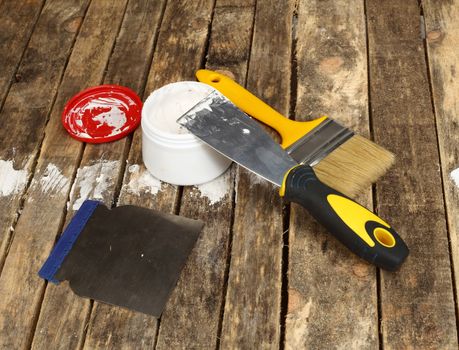 Putty knife with paste close up