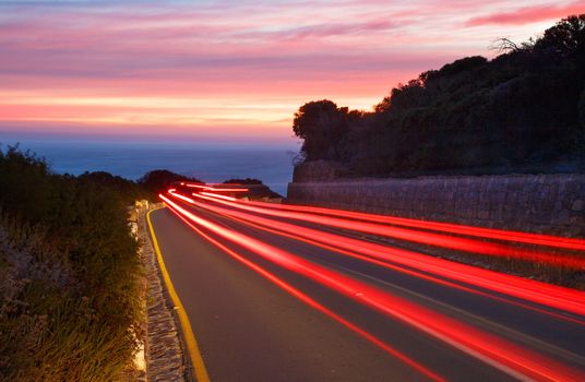 Light trails from passing cars at sunset