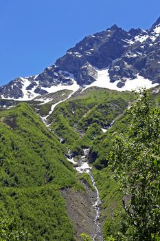 Caucasus Mountains Under Snow And Clear Blue Sky