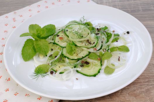 Cucumber salad, leek with mint and spices