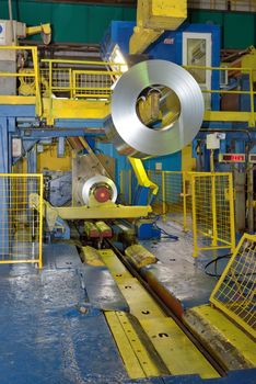 crane loading Coil steel in Steel plant, roll of steel sheet