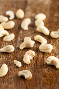 Organic raw cashew nuts unroasted and unsalted.  Close up macro still life with a shallow depth of field.