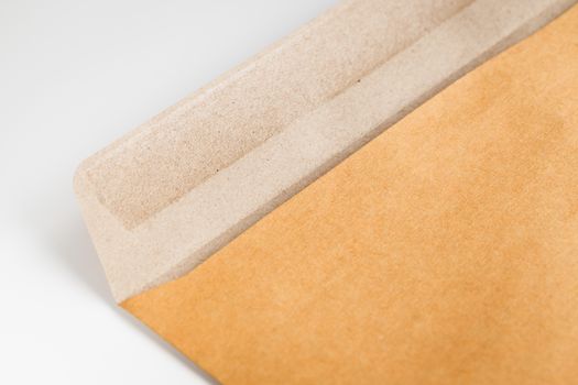 Open brown envelope on the table