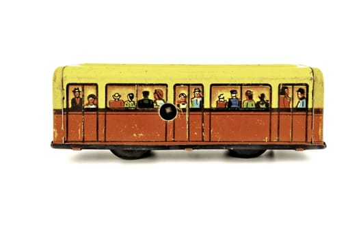 Subway wagon is powered by clockwork.  It  is old tin toy from Russia.