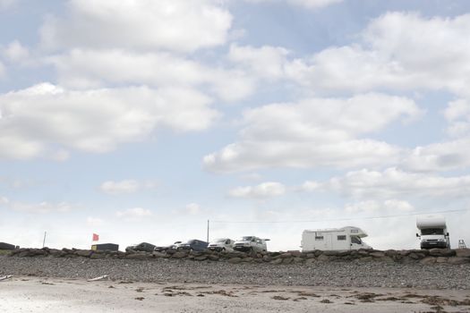 wind surfers vans parked on the wild atlantic way in county Kerry Ireland