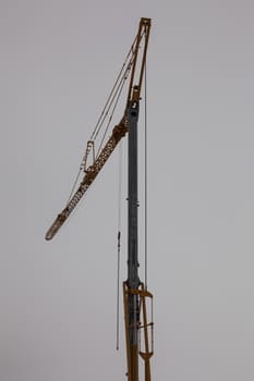 A tall lifting crane on a construction site