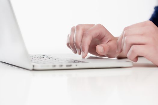 Closeup of Fingers Using Laptop Keyboard