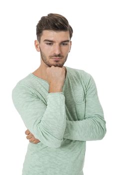 Puzzled handsome young man scratching his head with his hand as he looks at the camera with an uncertain perturbed expression, isolated on white