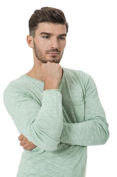 Puzzled handsome young man scratching his head with his hand as he looks at the camera with an uncertain perturbed expression, isolated on white