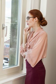 Close up Serious Pretty Office Woman in Stylish Business Attire Looking Outside Through Glass Window