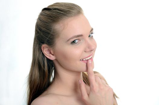 Pretty Polish model with gentle smile. Portrait of charming young girl with white background.