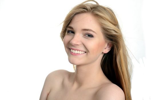 Pretty Polish model with big smile. Portrait of charming young girl with white background.