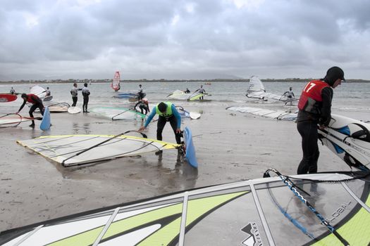 windsurfer getting ready to race and surf on the beach in the maharees county kerry ireland