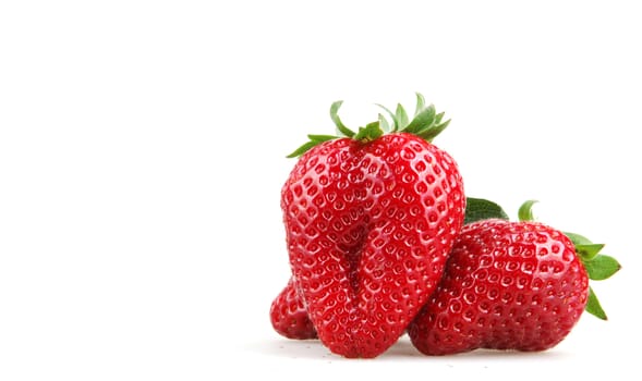 Strawberries With Leaves Isolated On A White Background