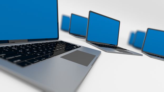 Many laptops in a circle isolated on white. Shallow depth of field.