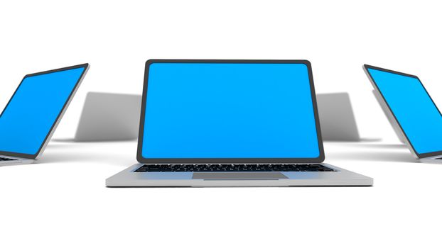 Laptops in a circle isolated on white. Shallow depth of field.